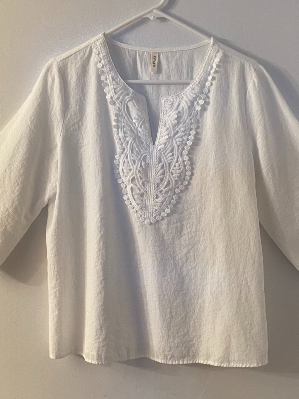 White 3/4 sleeve dressy/casual top by Evaless, excellent condition. Size L